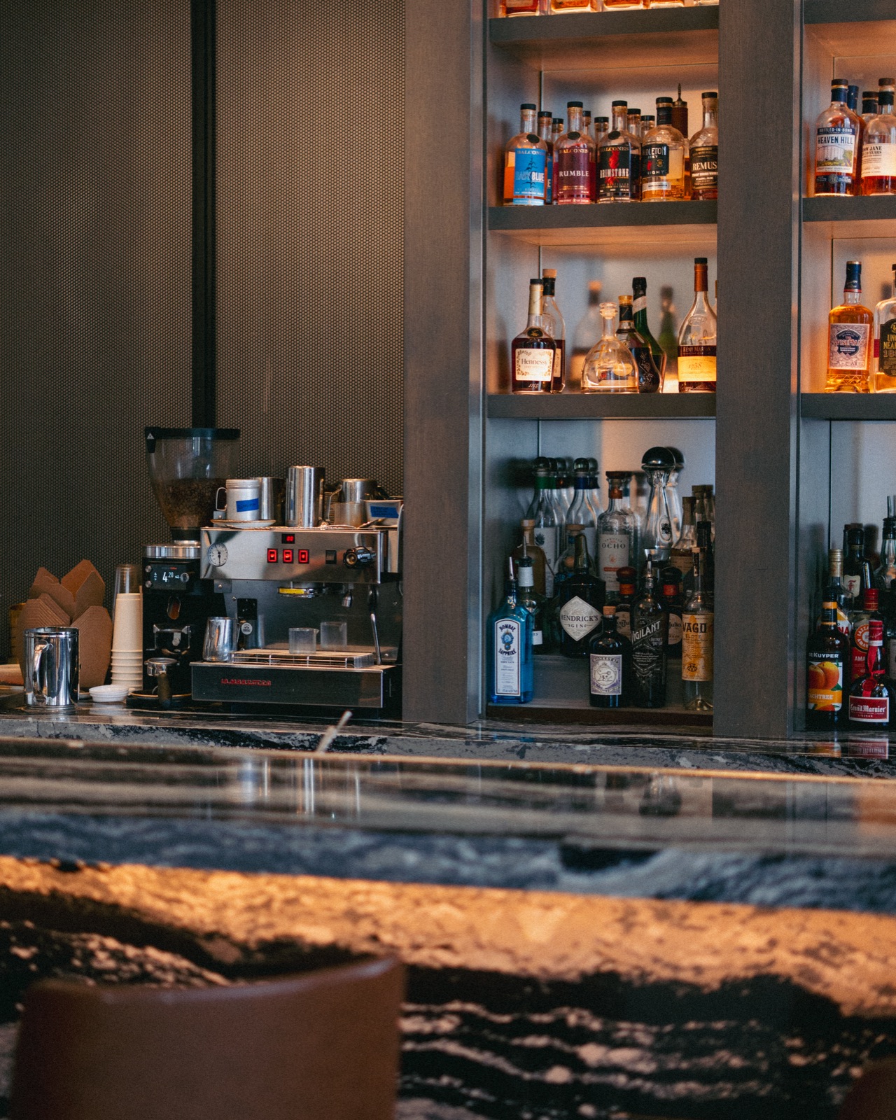 Godfrey bar with the coffee program integrated alongside the cocktail spirits shelf