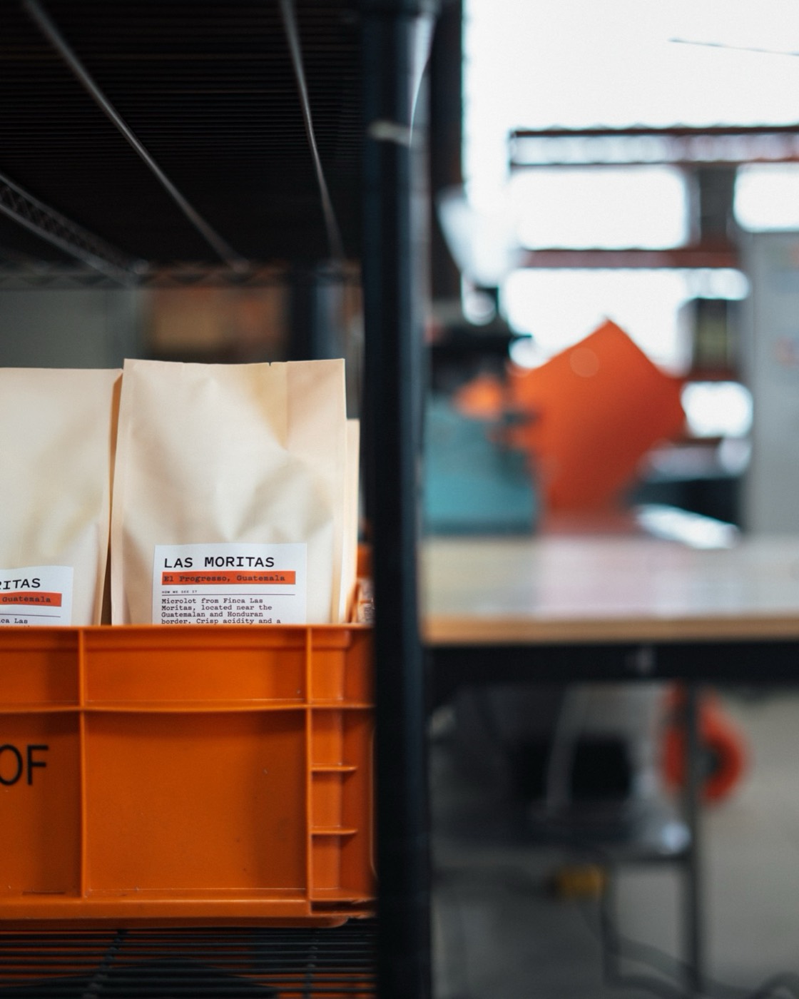 Las Moritas bags from El Progresso, Guatemala, stacked in an orange Coffeehaus crate at the Warehaus